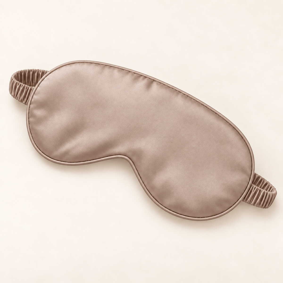 Hushly satin sleep mask in light coffee on warm ivory